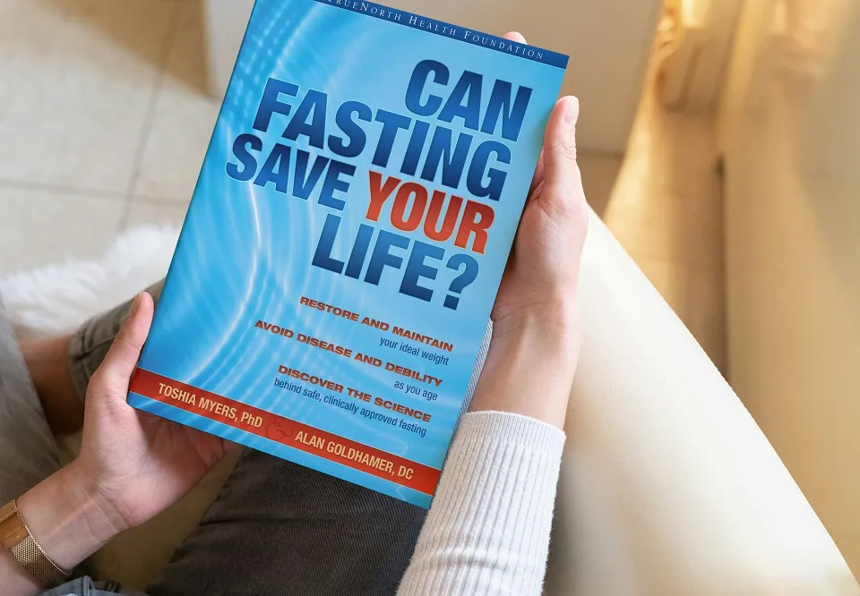 Woman holding fasting book