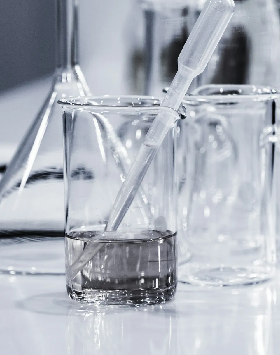 Glass of water with syringe