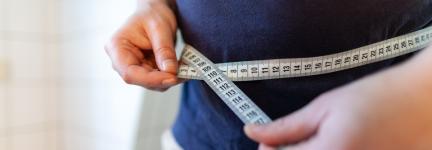 Person measuring circumference