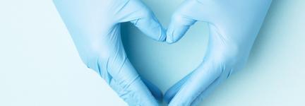 Hands with medical gloves making a heart shape